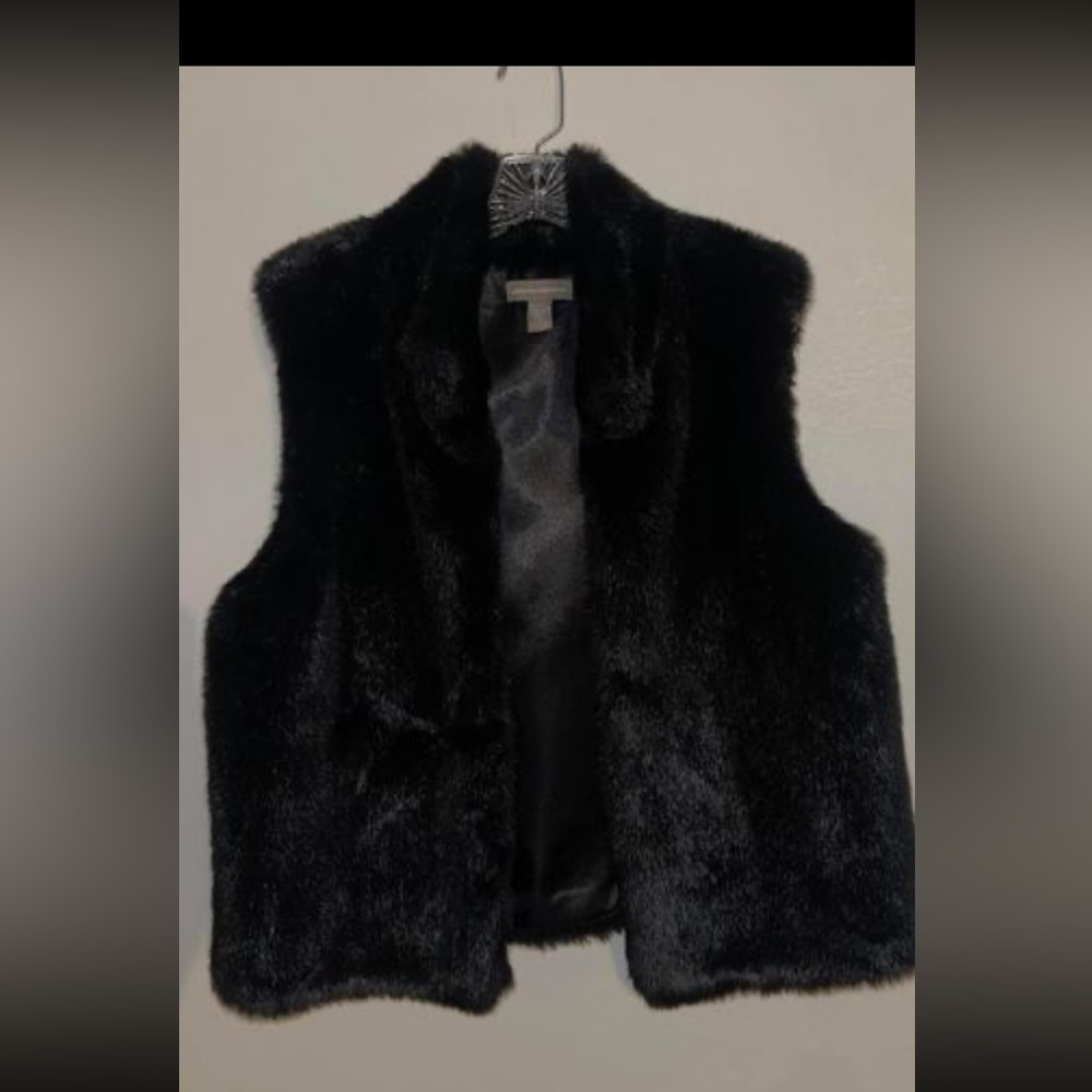 Never worn women’s faux fur jacket, very soft fur silk inner lining .